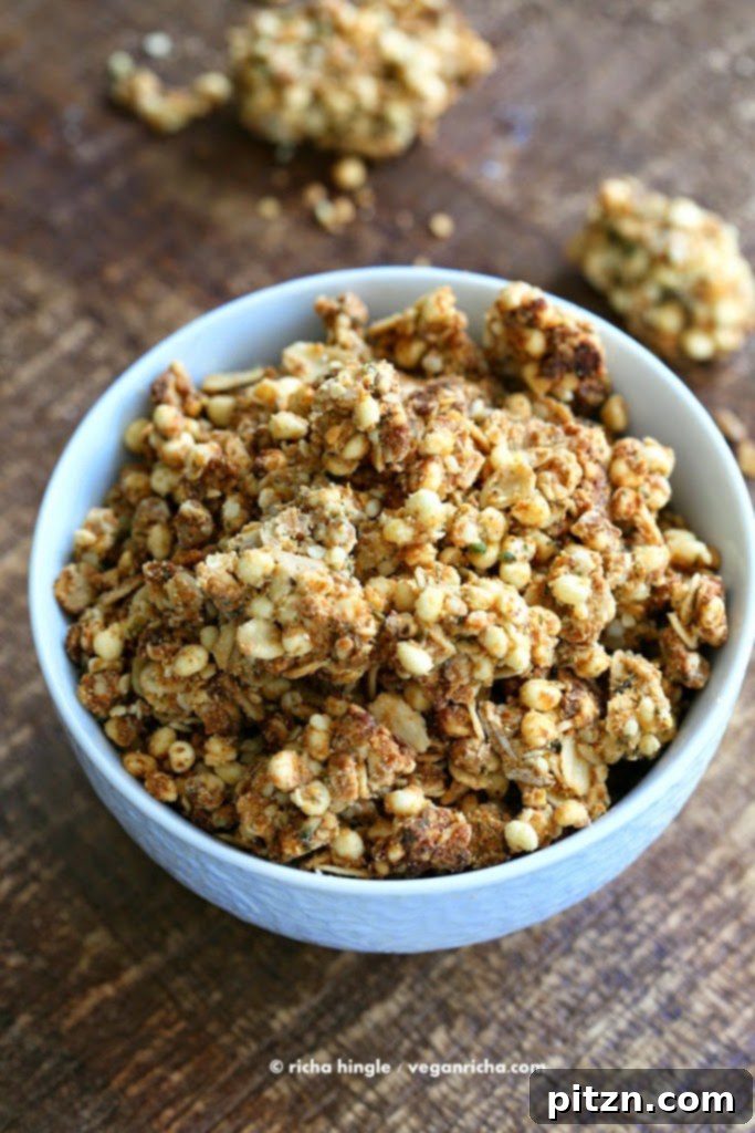 Savory Sour Cream and Onion Granola in a bowl with a spoon