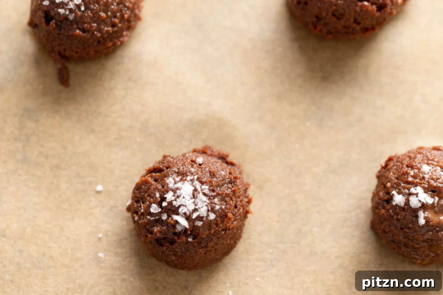 Another view of the perfectly portioned Vegan Brownie Cookie dough on a baking sheet before baking