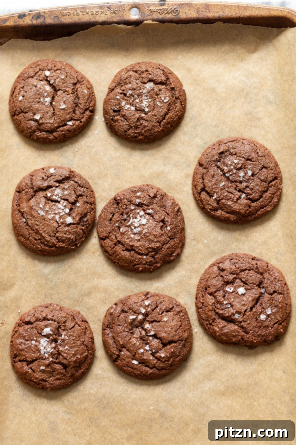 A tray of freshly baked Vegan Brownie Cookies, cooled and ready to be enjoyed, showcasing their perfect shape and rich color