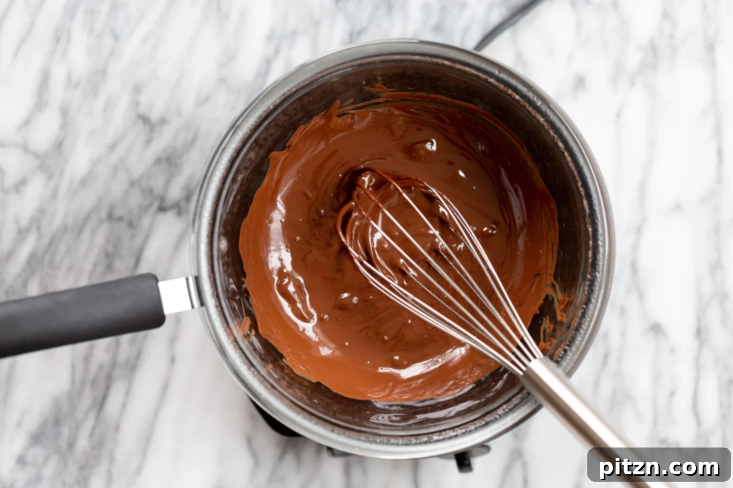 Easy 5-Ingredient Chocolate Avocado Freezer Fudge 6 Smooth, melted vegan chocolate in a double boiler, ready for the next ingredients.
