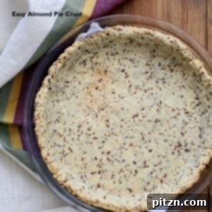 overhead shot of a vegan almond flour pie crust in a pyrex baking dish