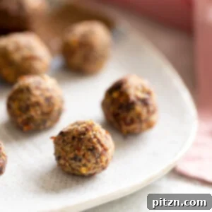 Close-up of perfectly baked vegan pizza snack bites on a white plate, highlighting their texture and savory appeal. Ideal for a gluten-free and grain-free diet.