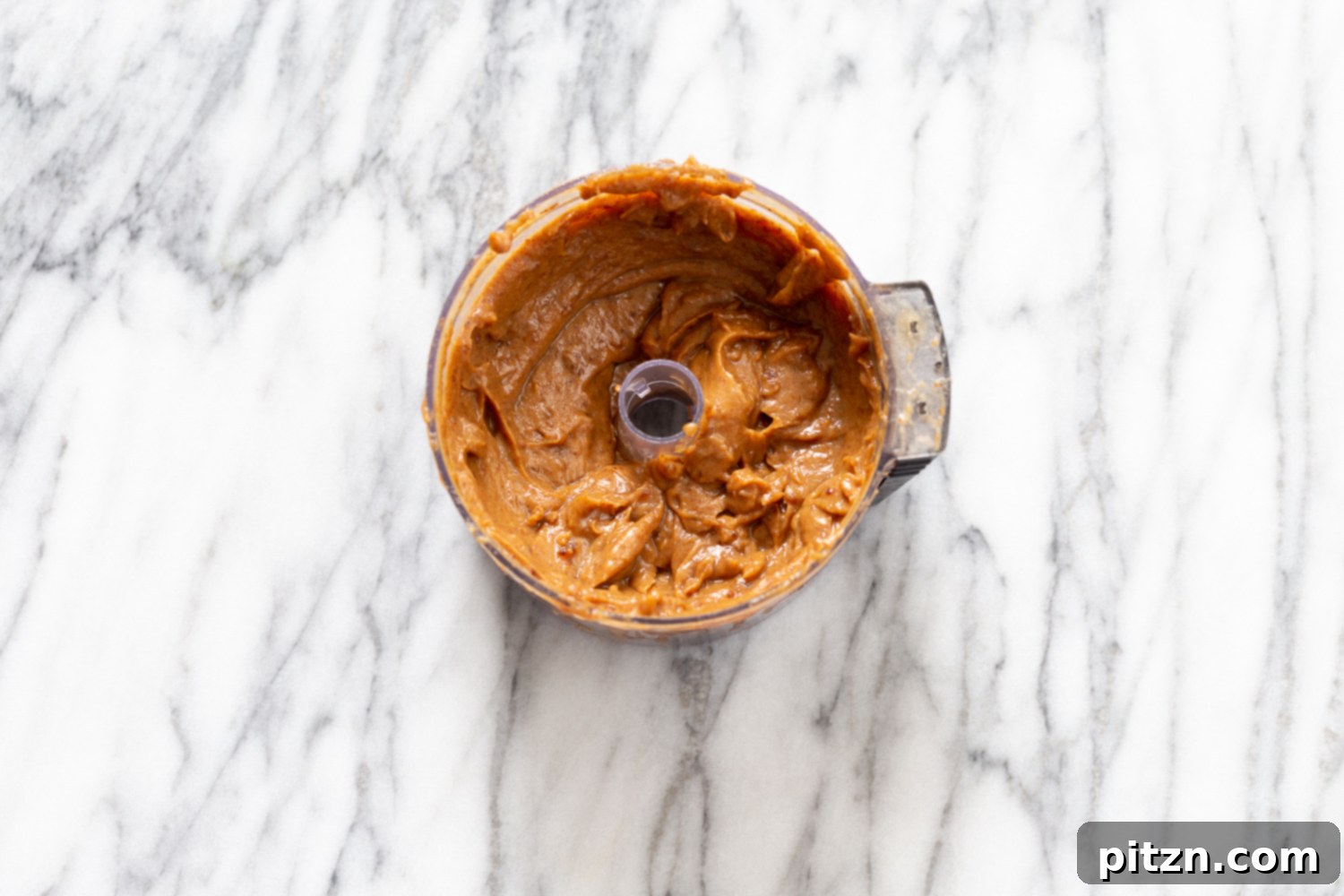 snickers recipe vegan date caramel in a food processor ready to be used as a filling for snickers