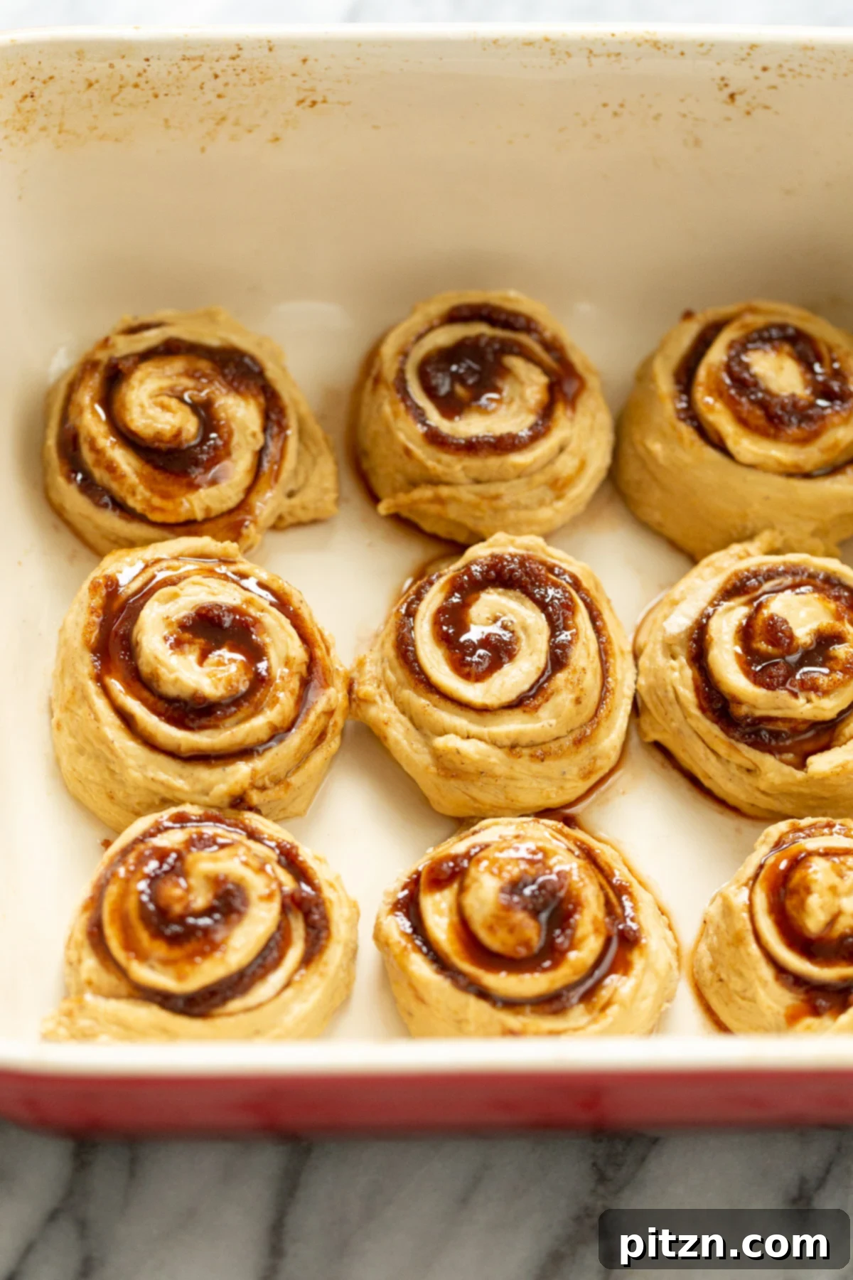 no yeast cinnamon rolls no yeast sweet potato cinnamon rolls in casserole dish ready to be baked