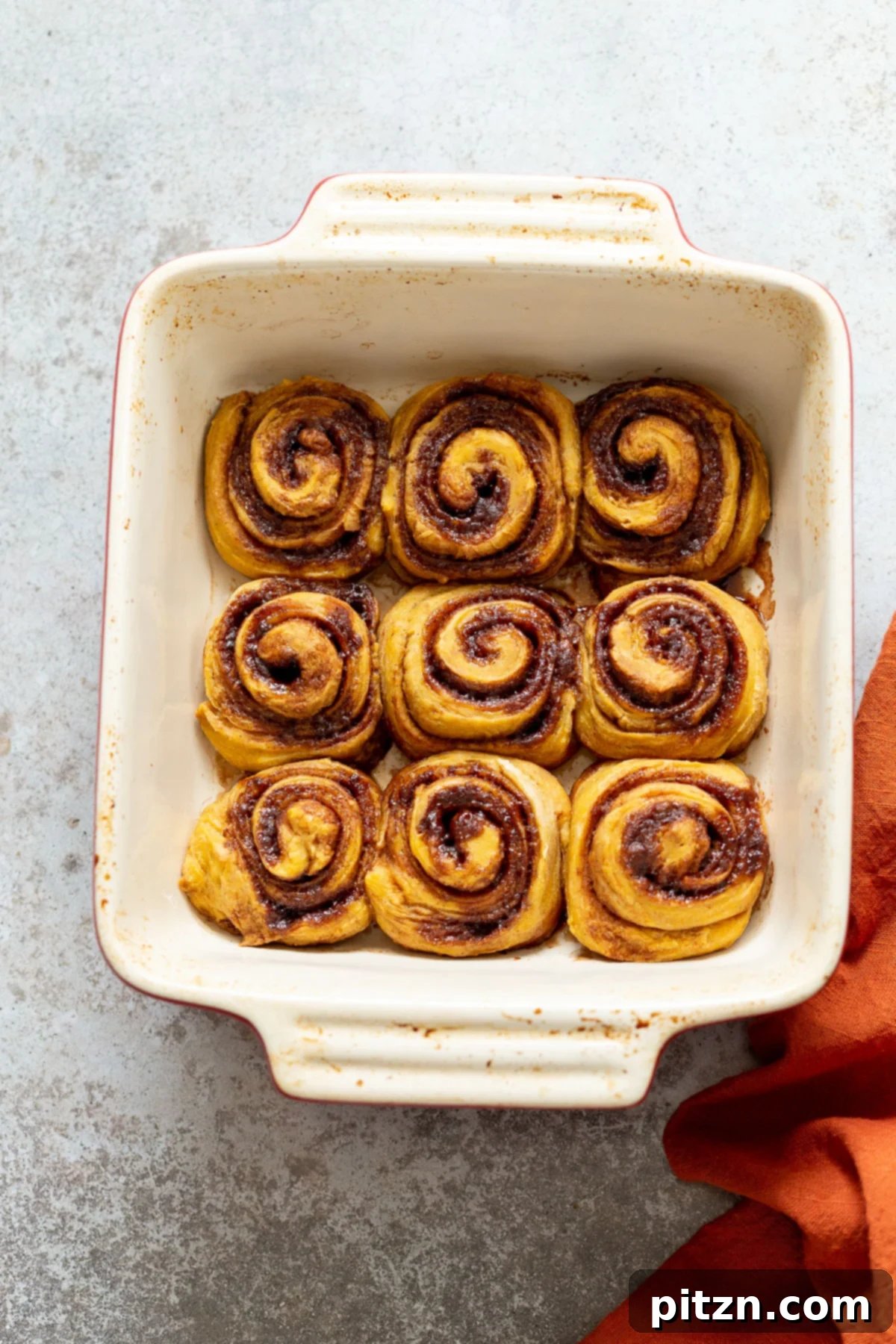 no yeast cinnamon rolls overhead shot of a casserole dish with freshly baked cinnamon rolls