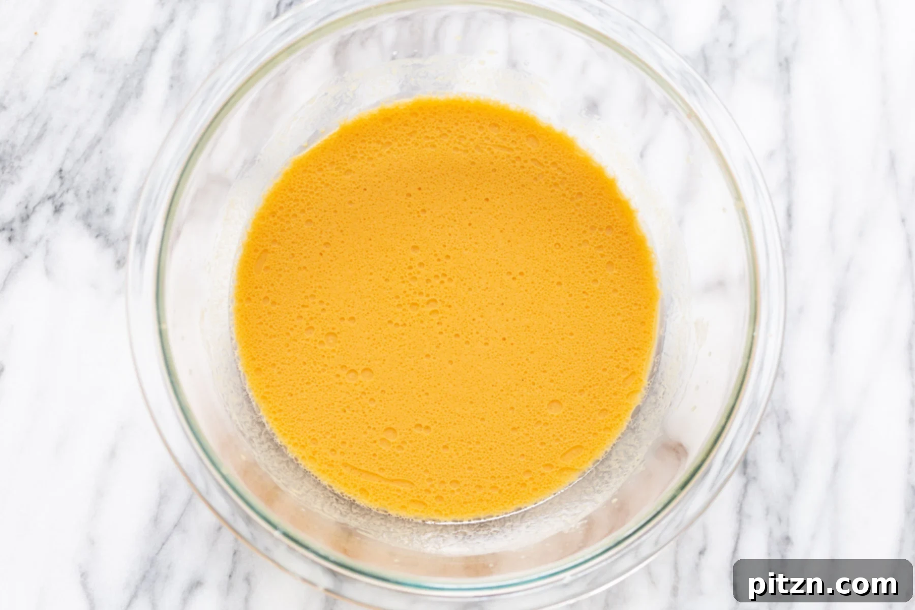 no yeast cinnamon rolls wet ingredients for sweet potato cinnamon rolls being mixed in a glass bowl