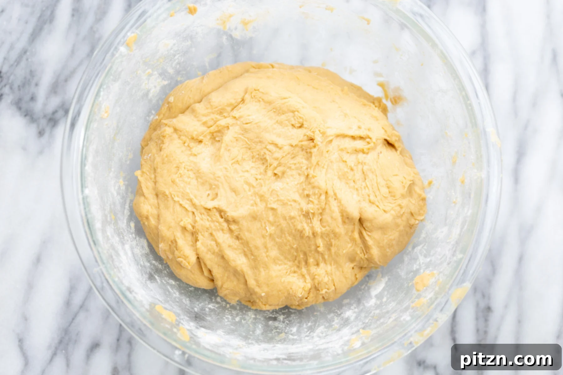 no yeast cinnamon rolls overhead shot no yeast cinnamon roll dough in glass bowl