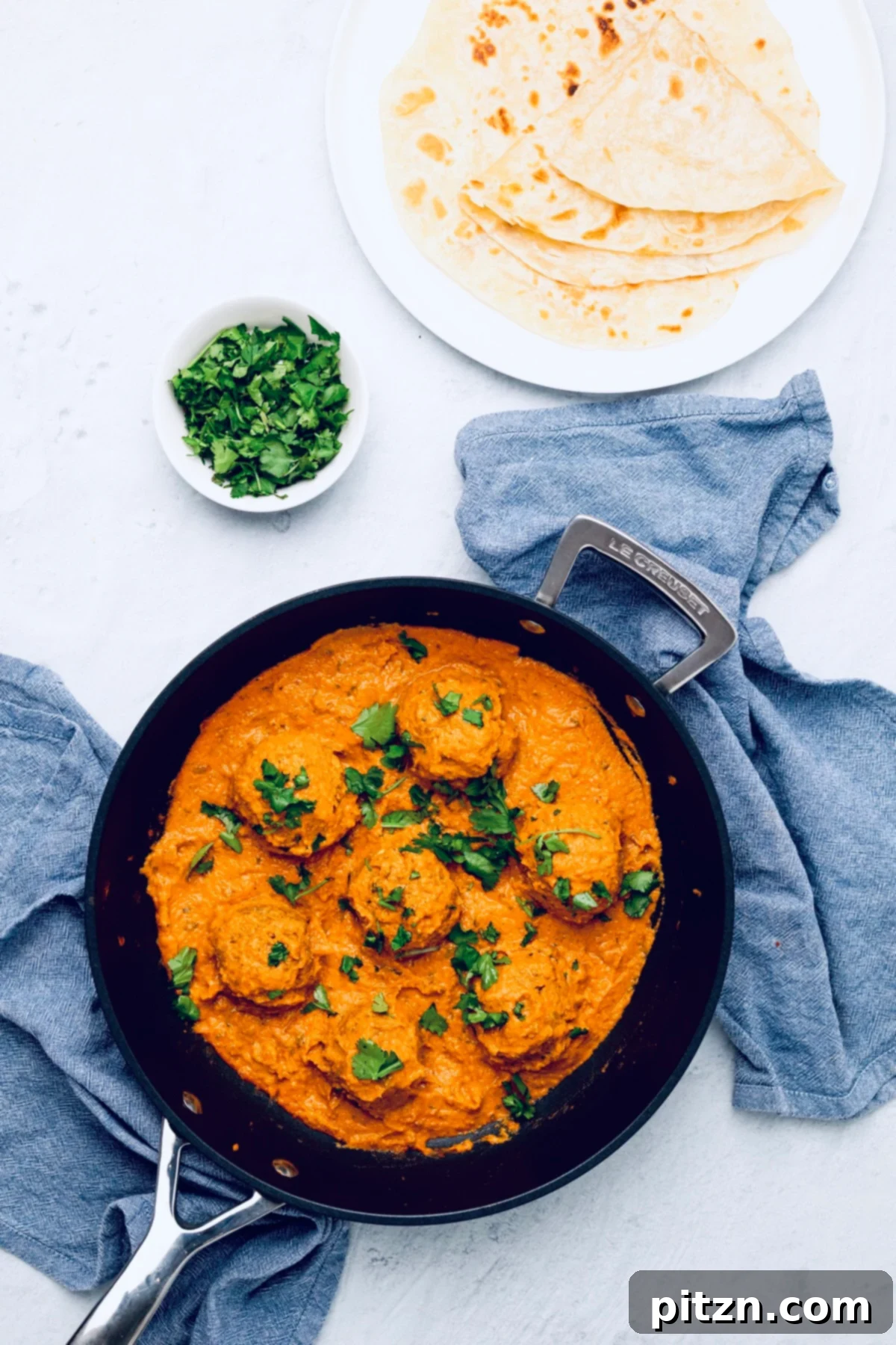 vegan malai kofta overhead shot of vegan malai kofta in a black skillet