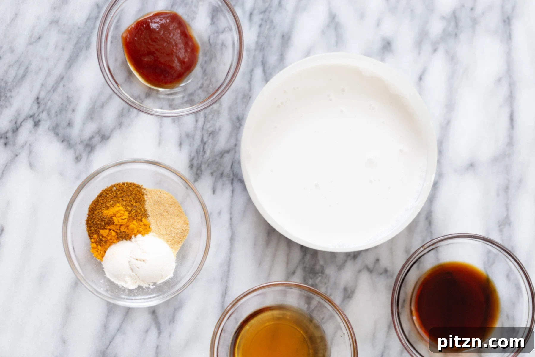 Vegan Katsu Curry Ingredients ingredients laid out for making vegan tofu katsu curry on a marble kitchen counter
