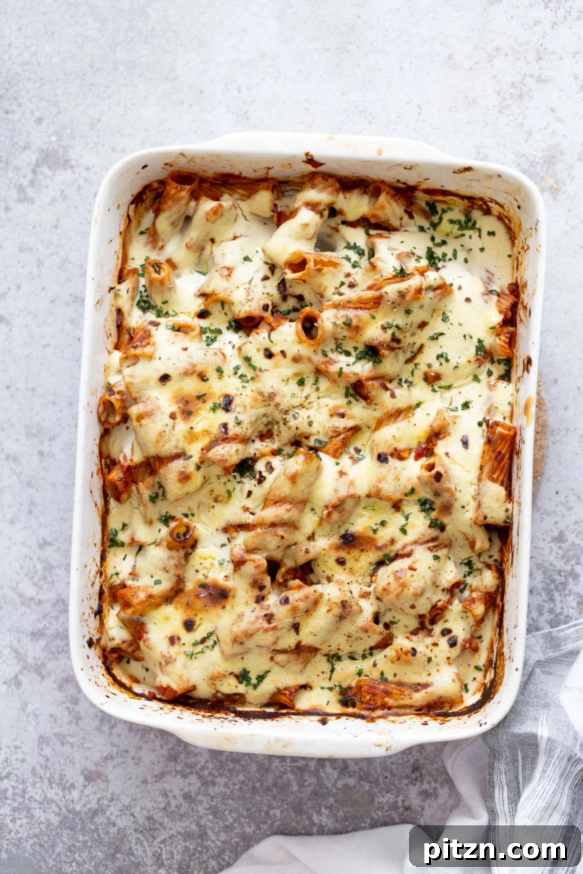 baked rigatoni overhead shot of a casserole dish with vegan baked rigatoni with tofu mozzarella