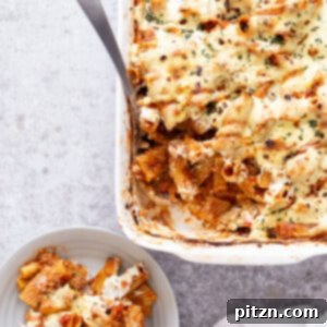 Hearty Vegan Rigatoni Bake 2 vegan baked rigatoni in a white casserole