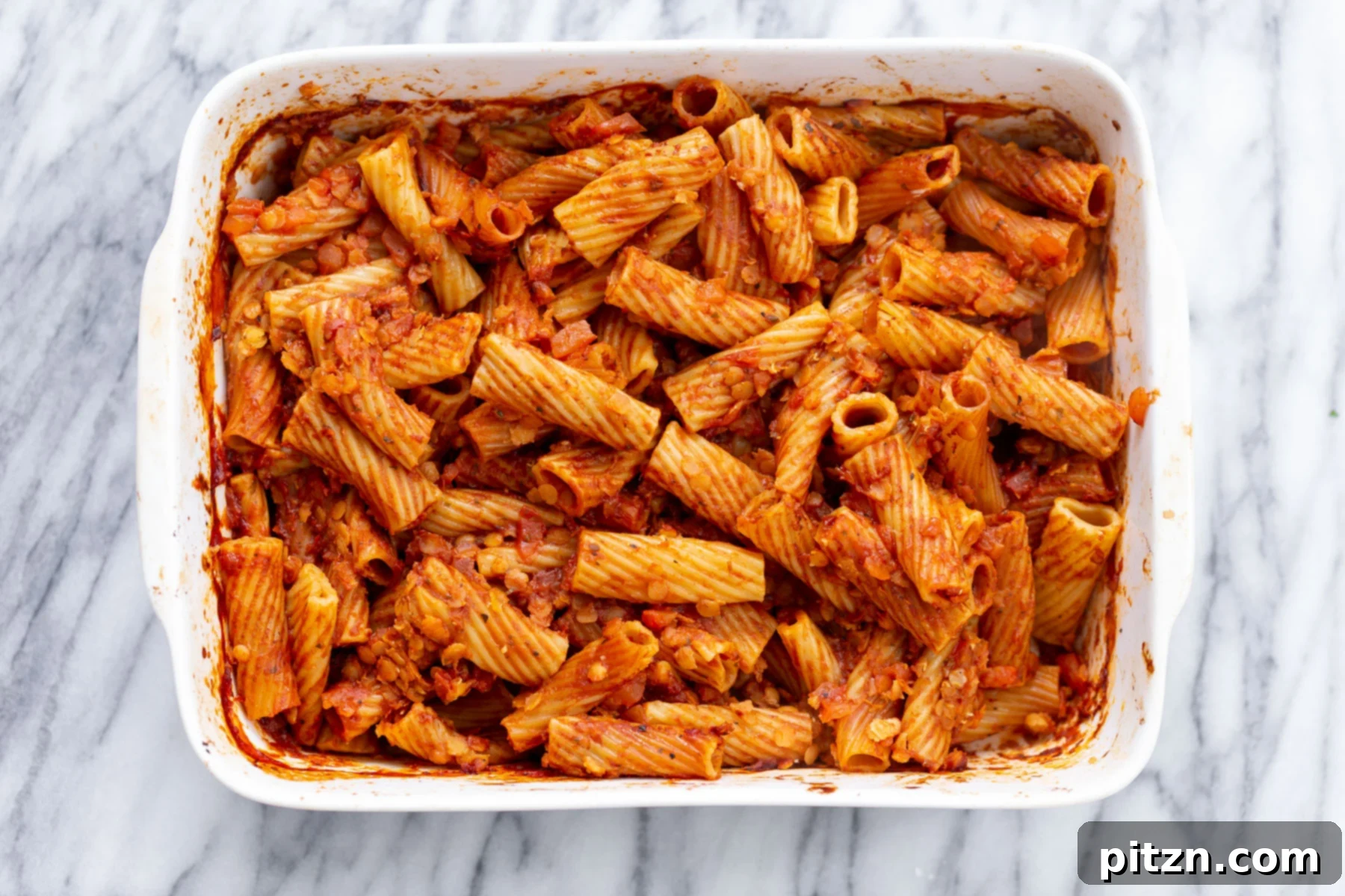 baked rigatoni overhead shot of vegan baked rigatoni before vegan tofu cheese sauce is added