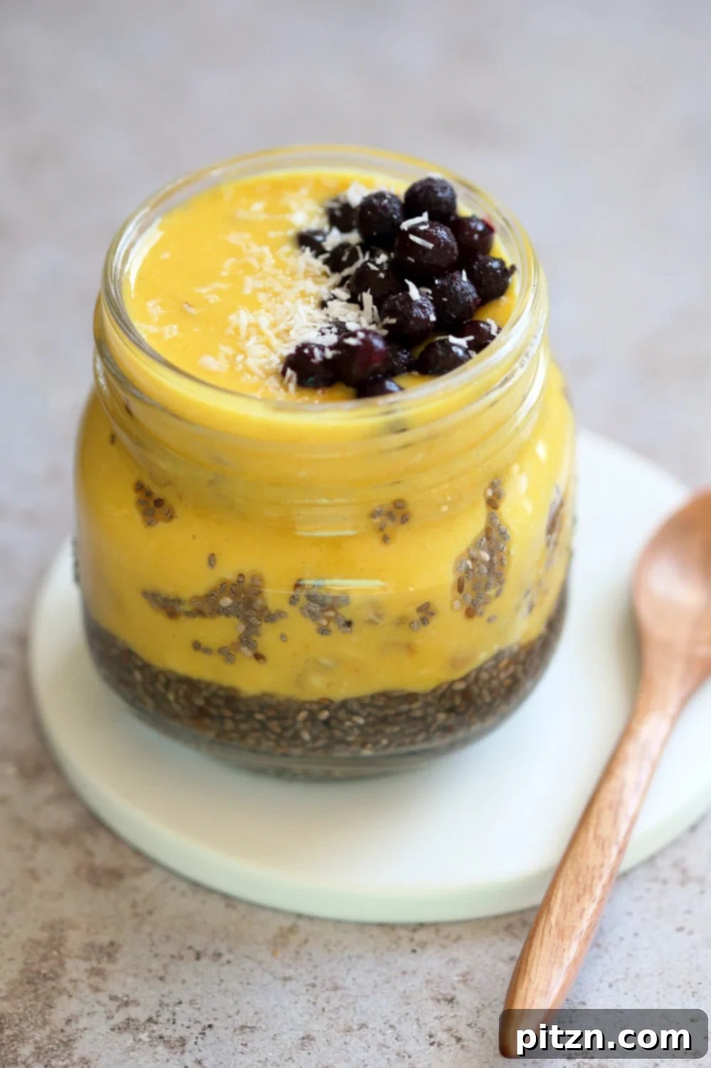 Summer Harvest: Your Guide to Seasonal Eats and Vegan Delights 9 Golden Mango Overnight Oats with Turmeric and Chia Seeds, a vibrant and healthy vegan breakfast, showcasing mango as a key summer fruit.