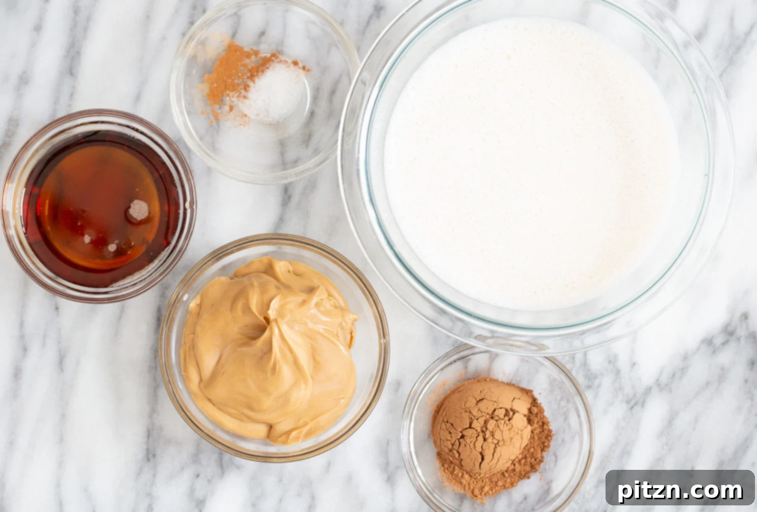 Ingredients for vegan peanut butter mousse displayed in various bowls