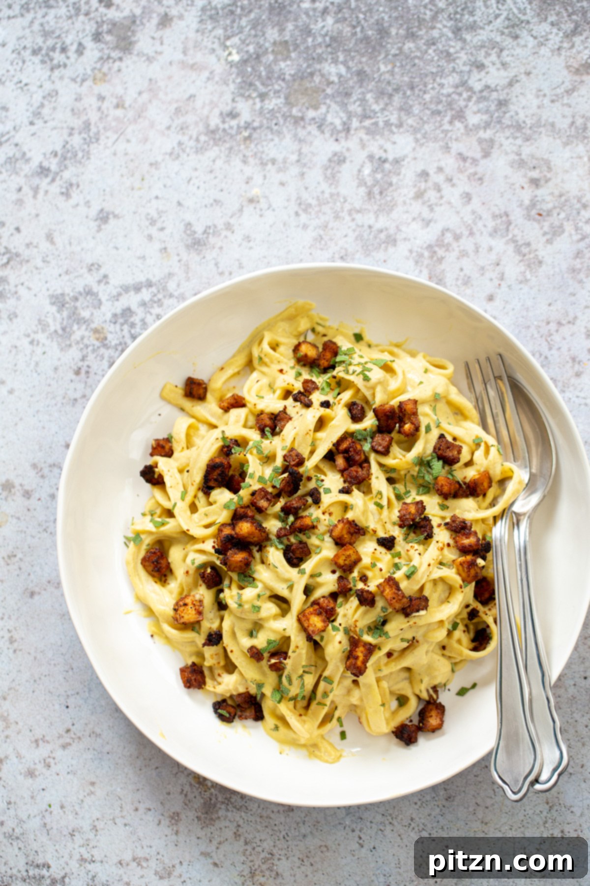 overhead shot of a vegan Butternut Squash Carbonara Pasta served with roasted tofu