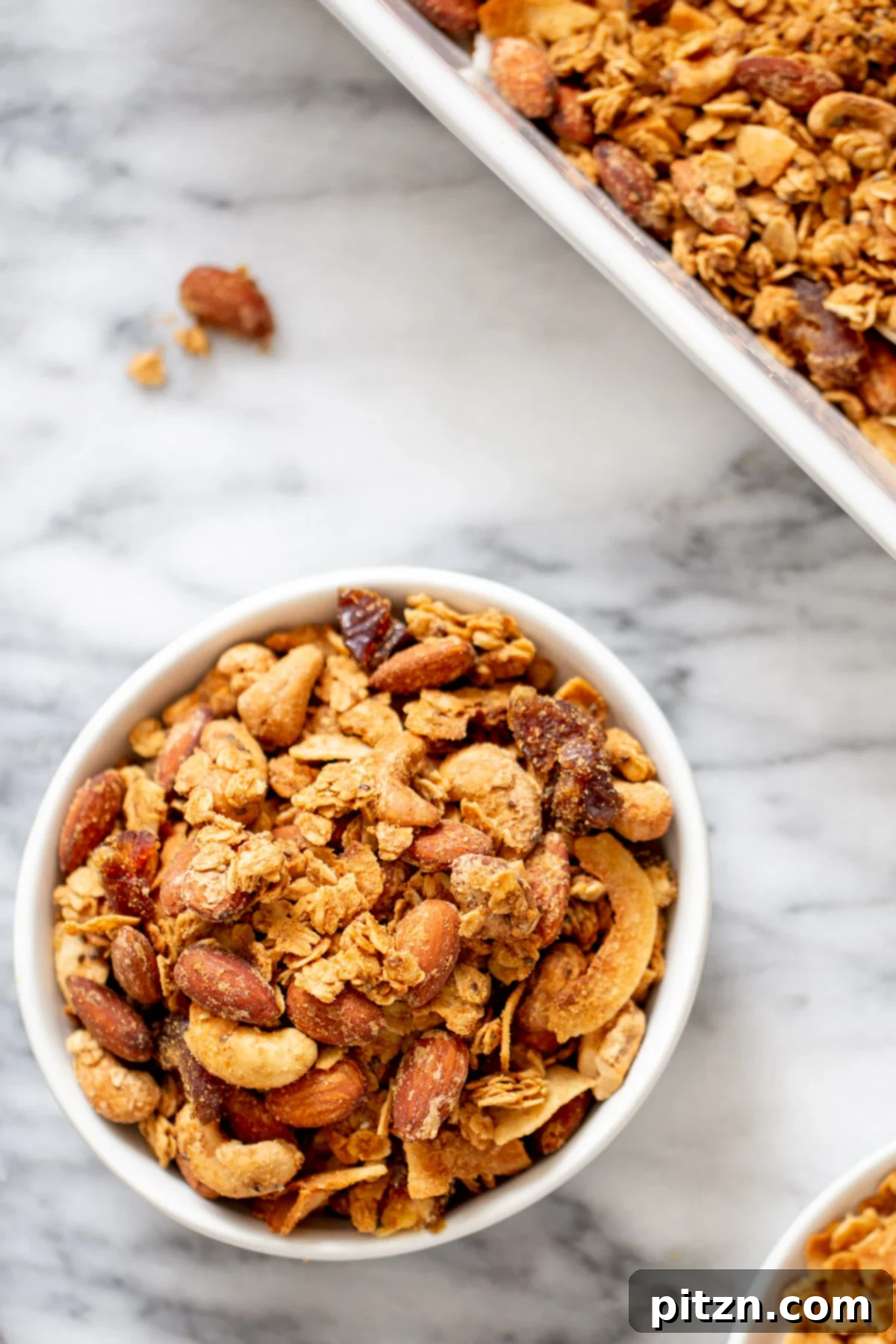 Vegan Granola Bowl Overhead shot of a bowl of baked vegan coconut almond granola