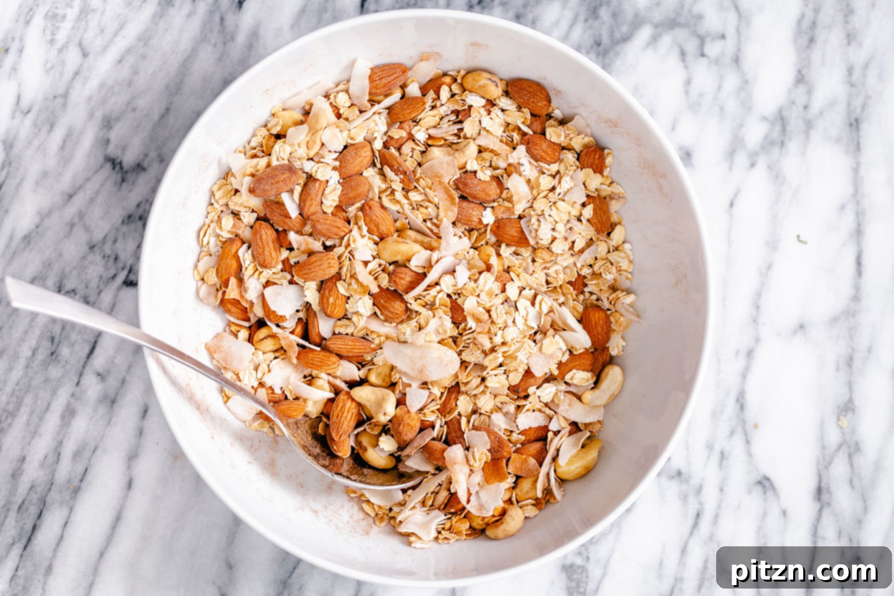Mixing Dry Granola Ingredients Dry granola ingredients being mixed in a small bowl