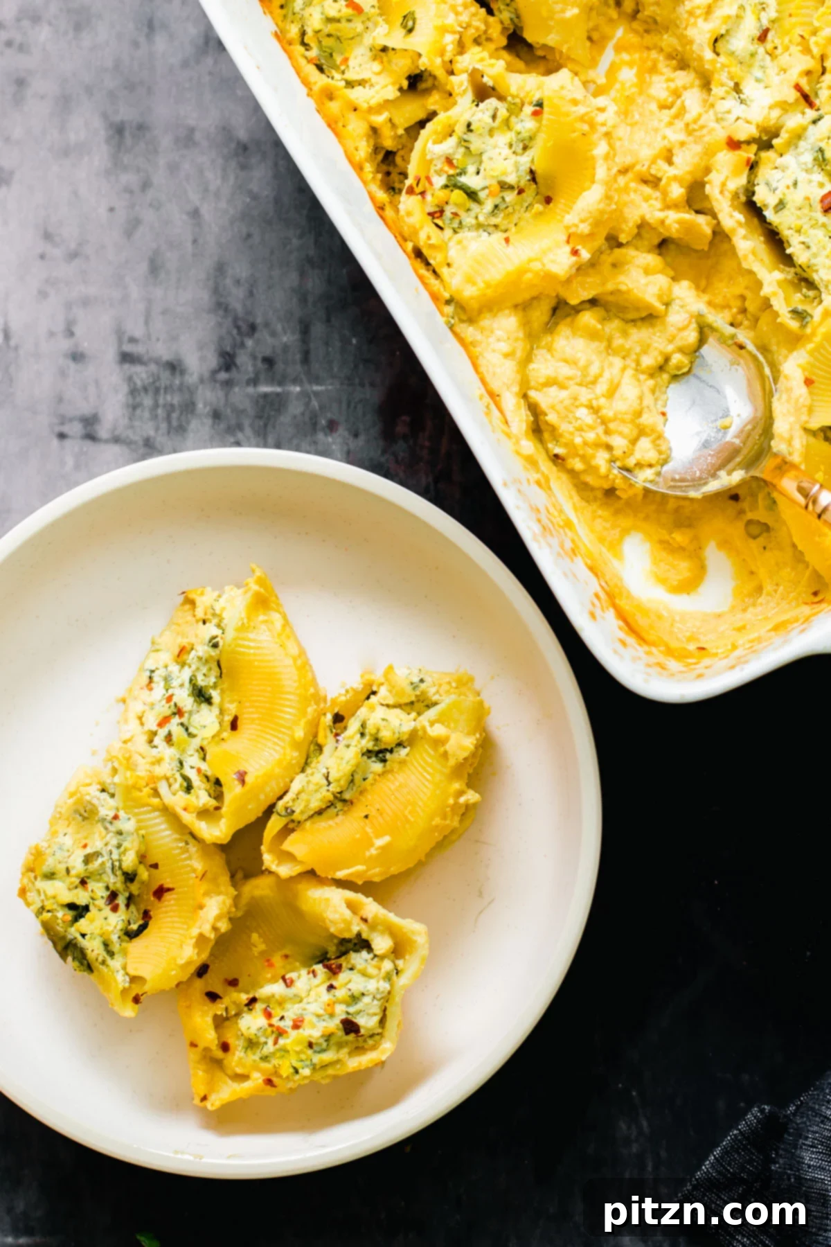 Individual Serving of Vegan Stuffed Shells A single serving of vegan stuffed shells beautifully presented on a plate.