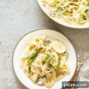 Veganuary Dash: 15 Quick 30-Minute Plant-Powered Meals 11 A vibrant bowl of Vegan Lemon Asparagus Pasta, featuring fettuccine in a creamy lemon sauce.