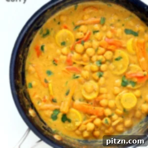 Veganuary Dash: 15 Quick 30-Minute Plant-Powered Meals 15 Chickpeas in Turmeric Peanut Butter Curry, served with rice and garnished with fresh herbs.