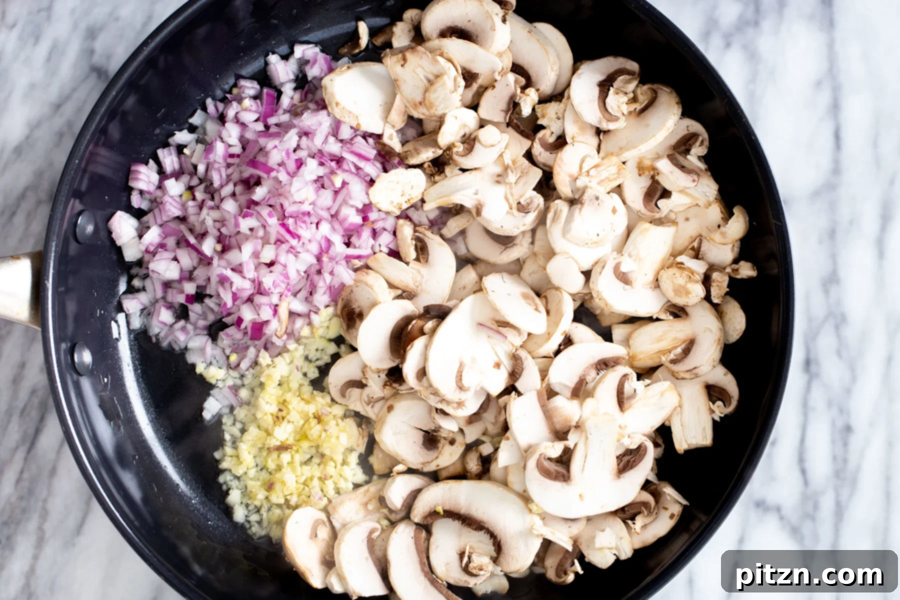 vegan mushroom stroganoff garlic, mushrooms and minced garlic in a frying pan