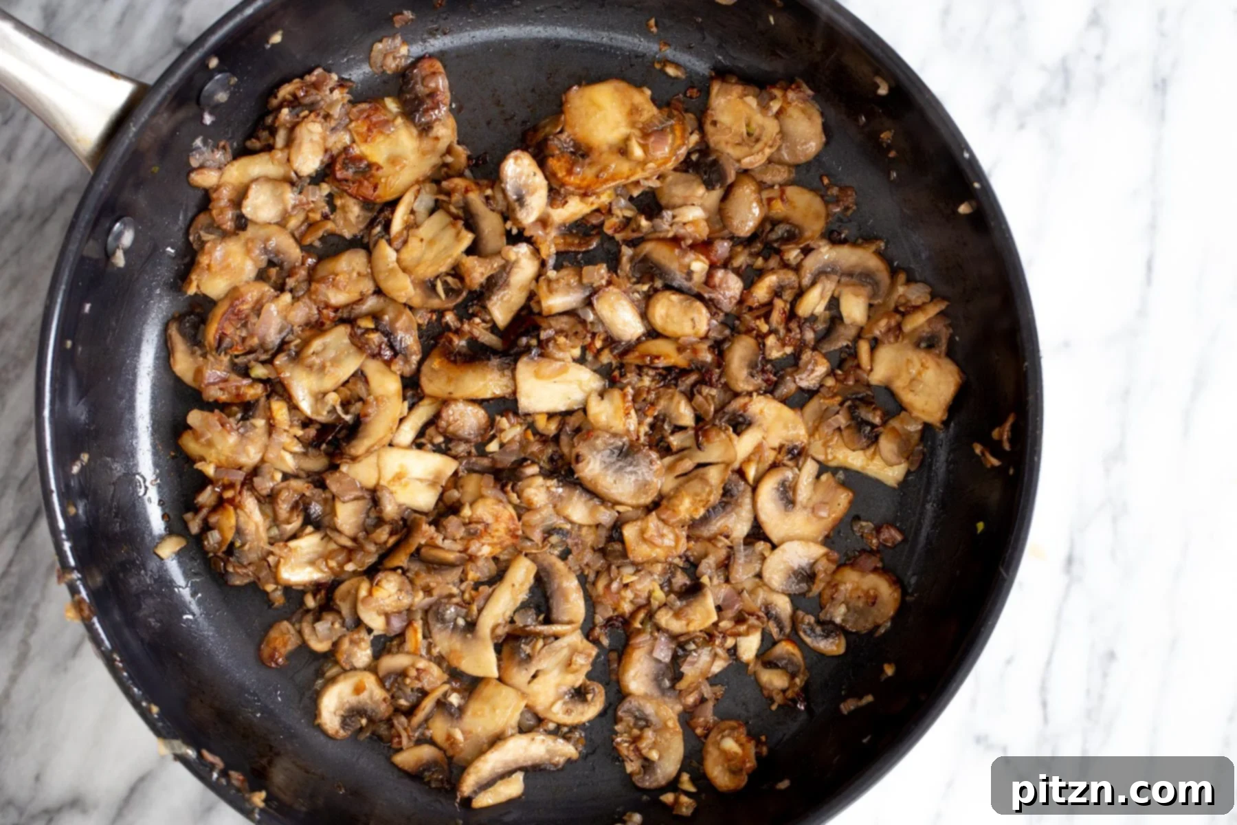 vegan mushrooms stroganoff sauteed mushrooms in a frying pan