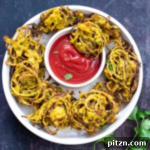Close-up of a beautifully baked pakora, golden-brown and perfectly crispy, showcasing the delicious texture and inviting appearance of this healthy Indian snack.