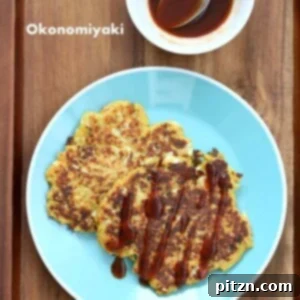 Vegan Okonomiyaki - Cabbage Carrot Pancakes topped with sauce and scallions