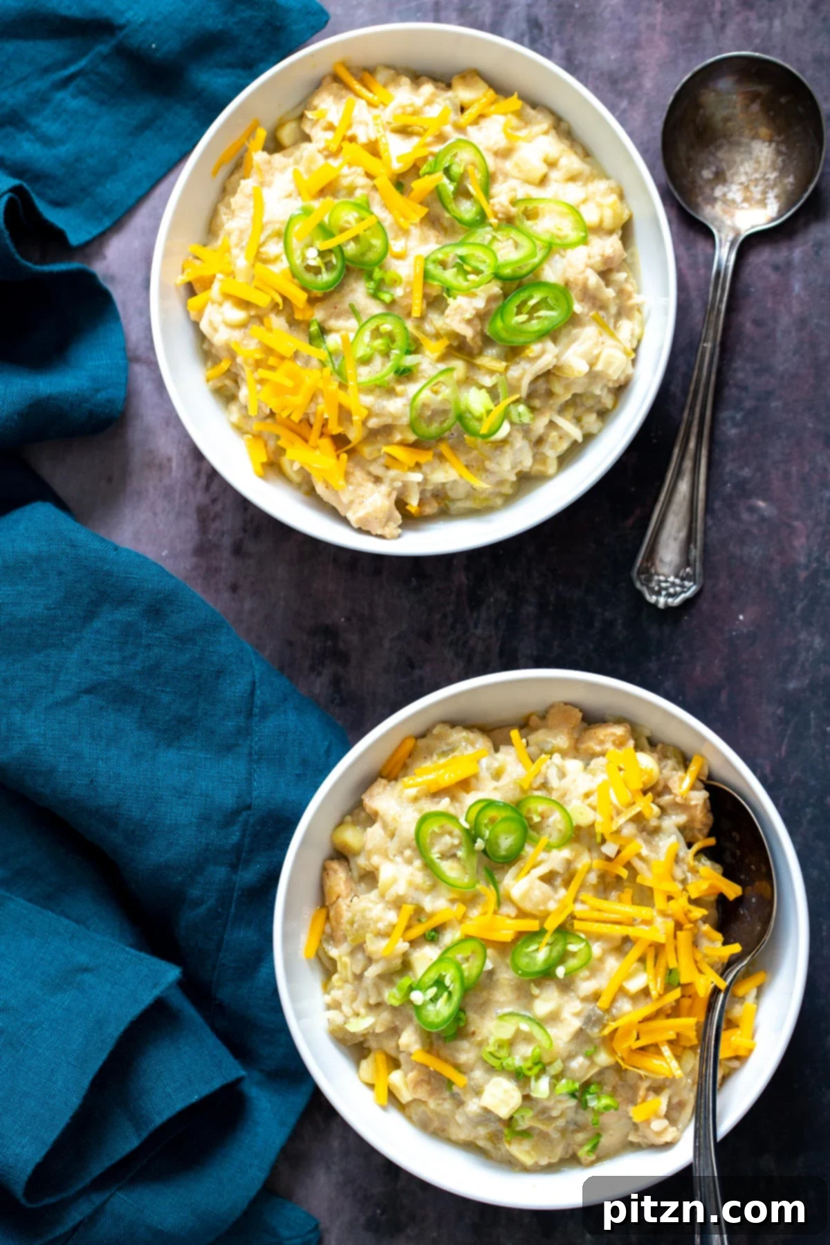vegan enchilada soup two bowls of vegan green chile enchilada soup with vegan shredded cheese and sliced green chiles ready to be served