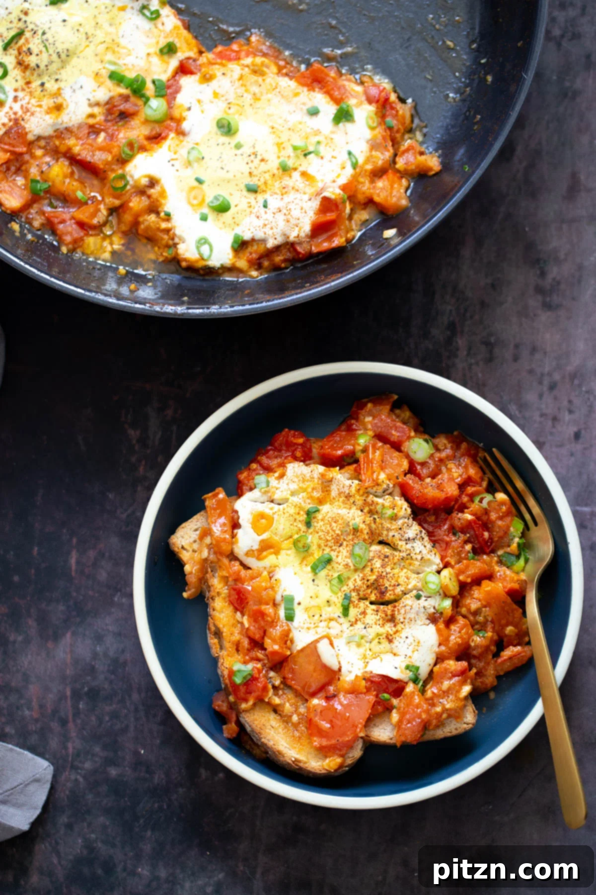 vegan eggs in purgatory overhead shot of two servings of vegan eggs in purgatory made with tofu eggs