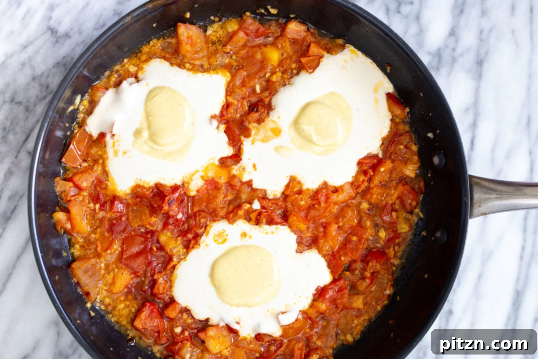 Vegan Tofu Shakshuka 11 turmeric egg yolks being added on top of tofu egg