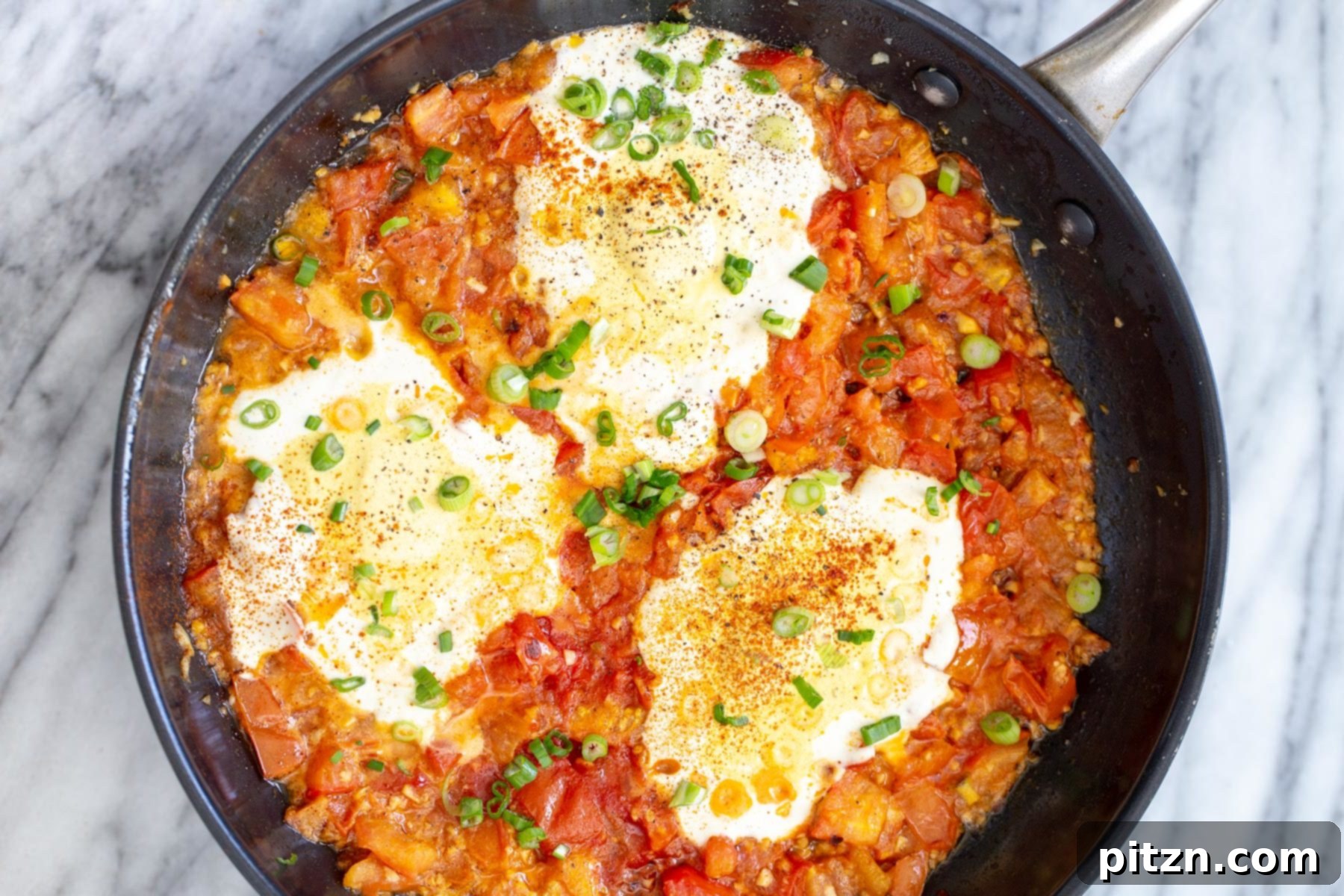 Vegan Tofu Shakshuka 12 overhead shot of a skillet with vegan eggs in purgatory