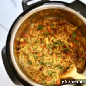 A comforting bowl of Instant Pot Kitchari, a traditional Ayurvedic blend of rice and lentils, garnished with fresh cilantro.