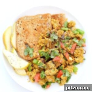 A hearty serving of Chickpea Flour Scramble garnished with fresh herbs, offering a flavorful and protein-rich vegan breakfast option.