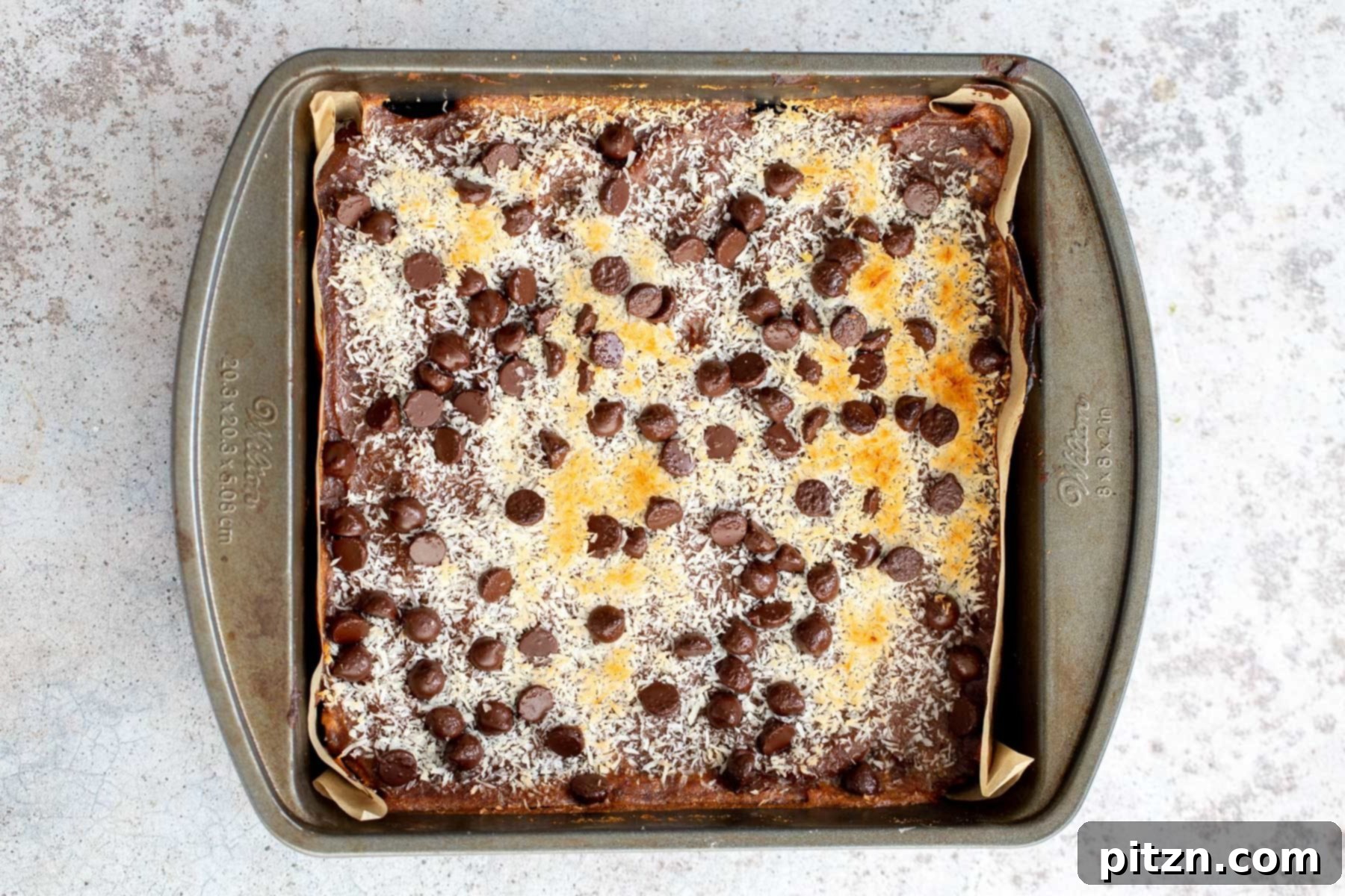 a square baking pan with vegan caramel oatmeal snack bars 