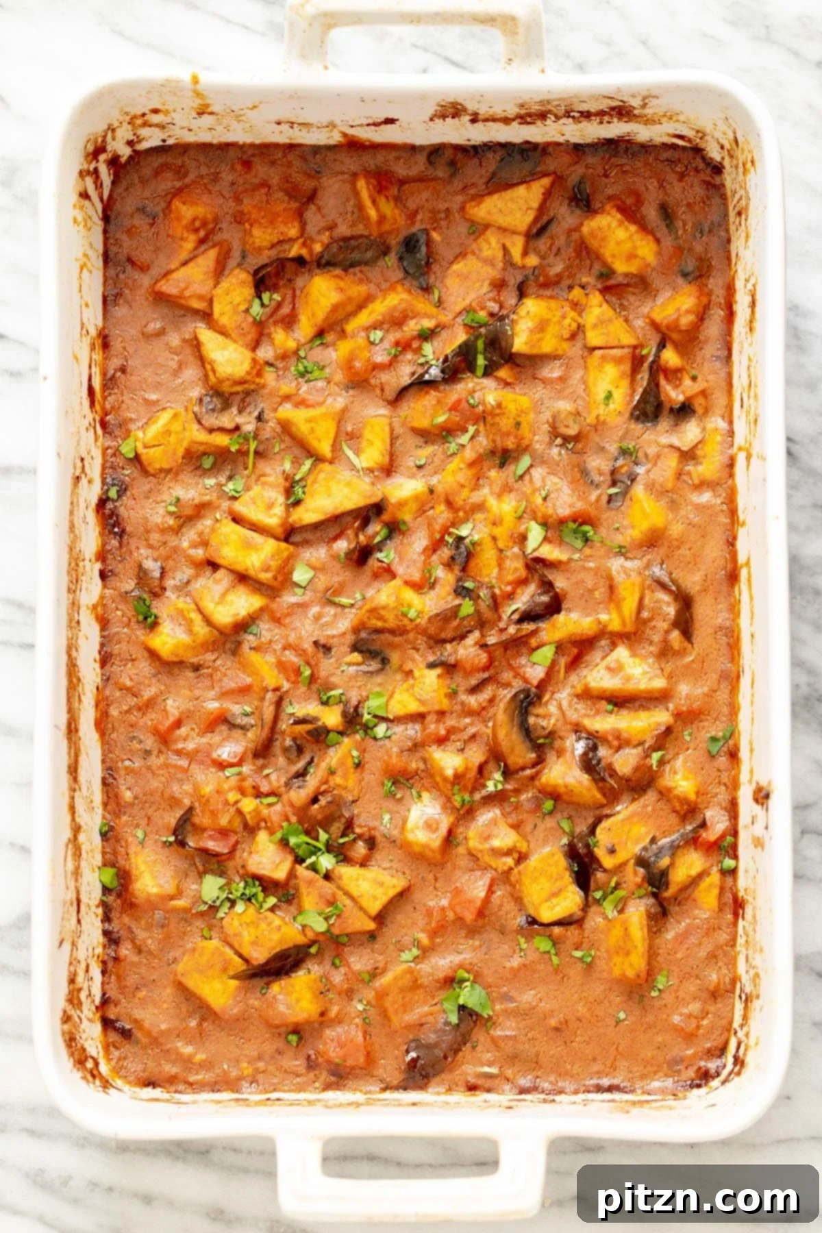 A beautifully baked Indian Madras Curry Tofu Casserole, fresh from the oven and ready to be served.