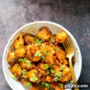 Golden Baked Cauliflower Manchurian 16 Cauliflower Manchurian in a bowl, ready to be served