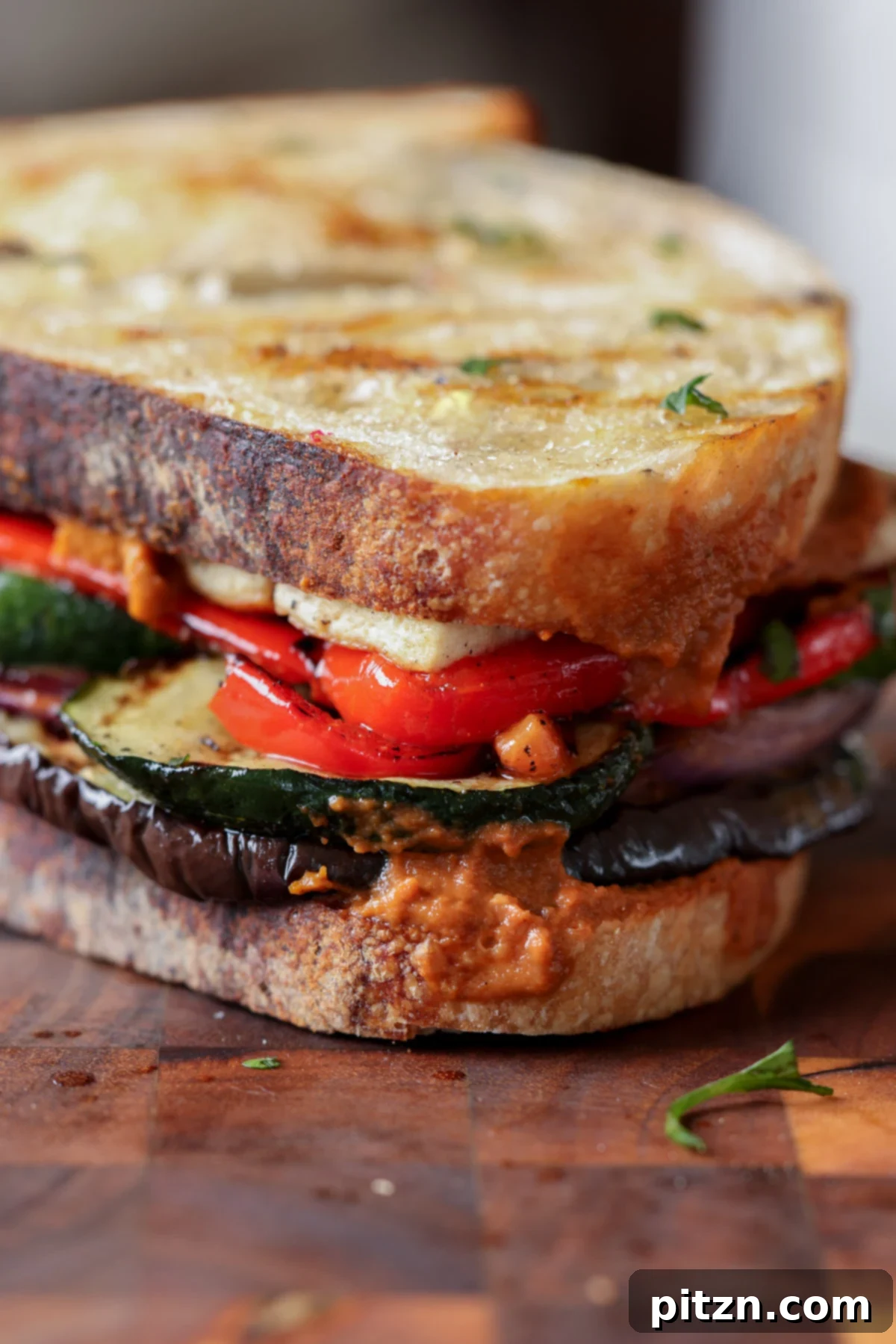 Mediterranean Grilled Veggie with Sun-Kissed Tomato & Basil Pesto 3 close-up of the grilled veggie sandwich with vibrant colors