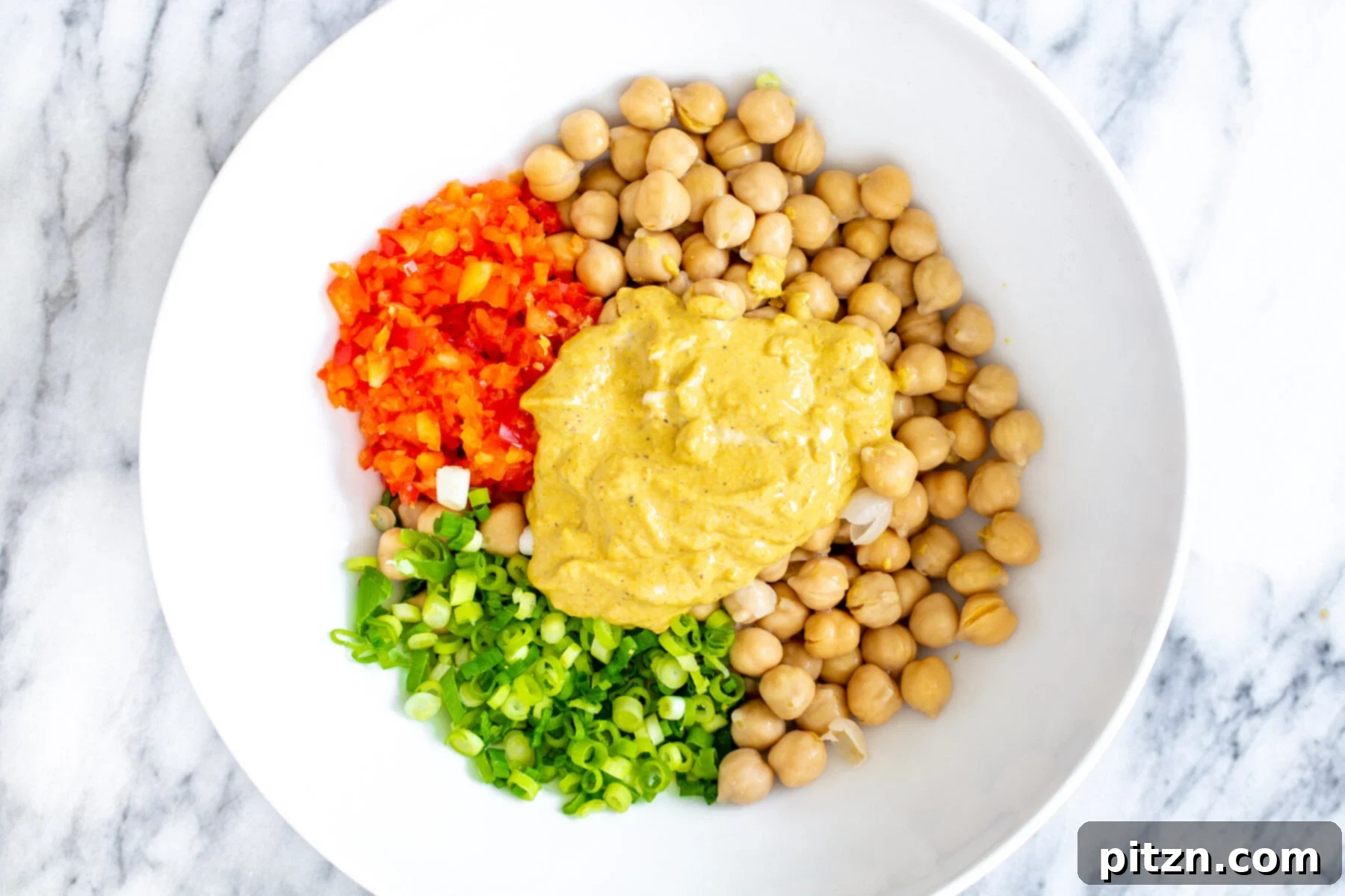 chickpea breakfast ingredients for vegan chickpea scramble in a white bowl