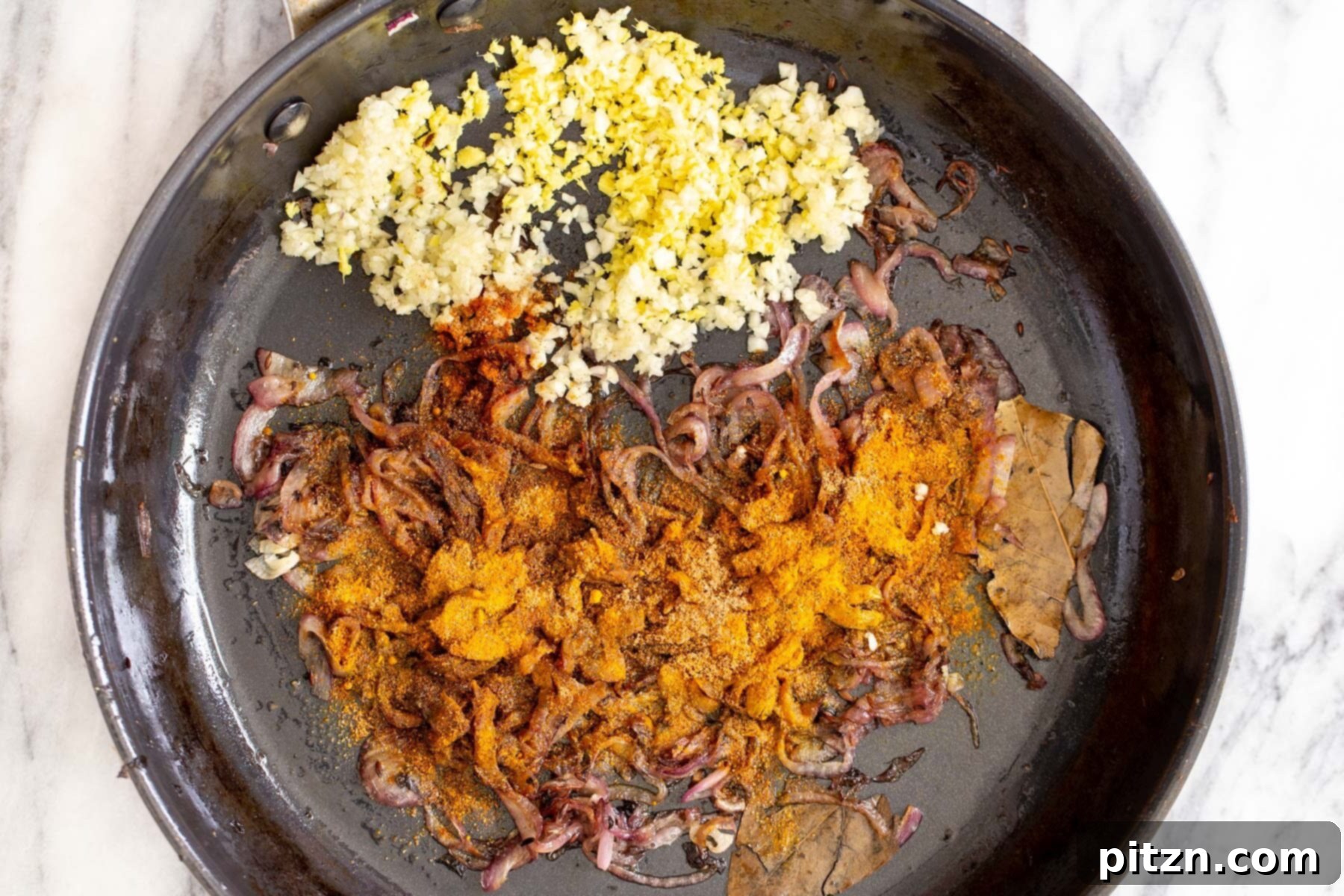 Rich Double Onion Cauliflower 10 Minced garlic, ginger, and a vibrant array of ground spices are added to the caramelized onions in a saucepan, infusing the base with profound flavors.