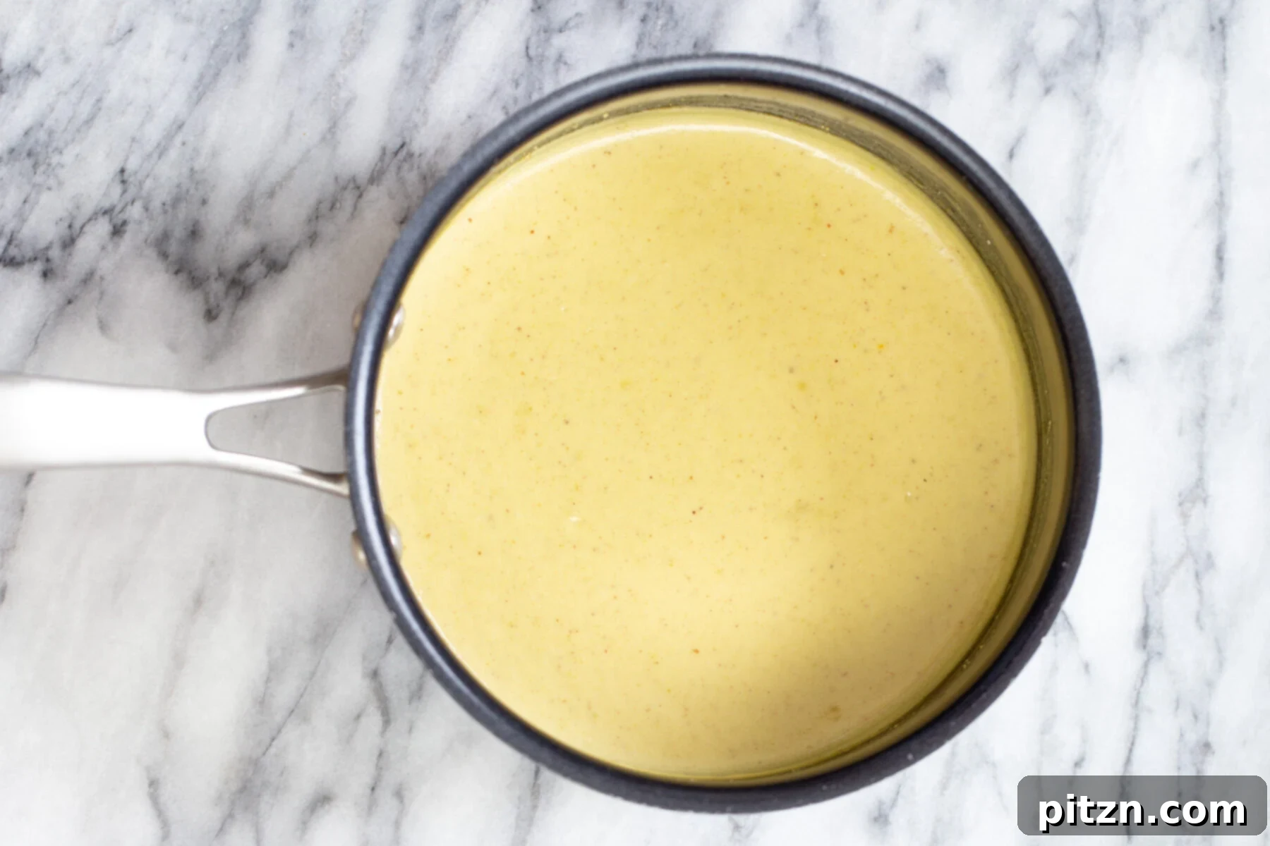 Nut milk thickened with almond flour in a saucepan