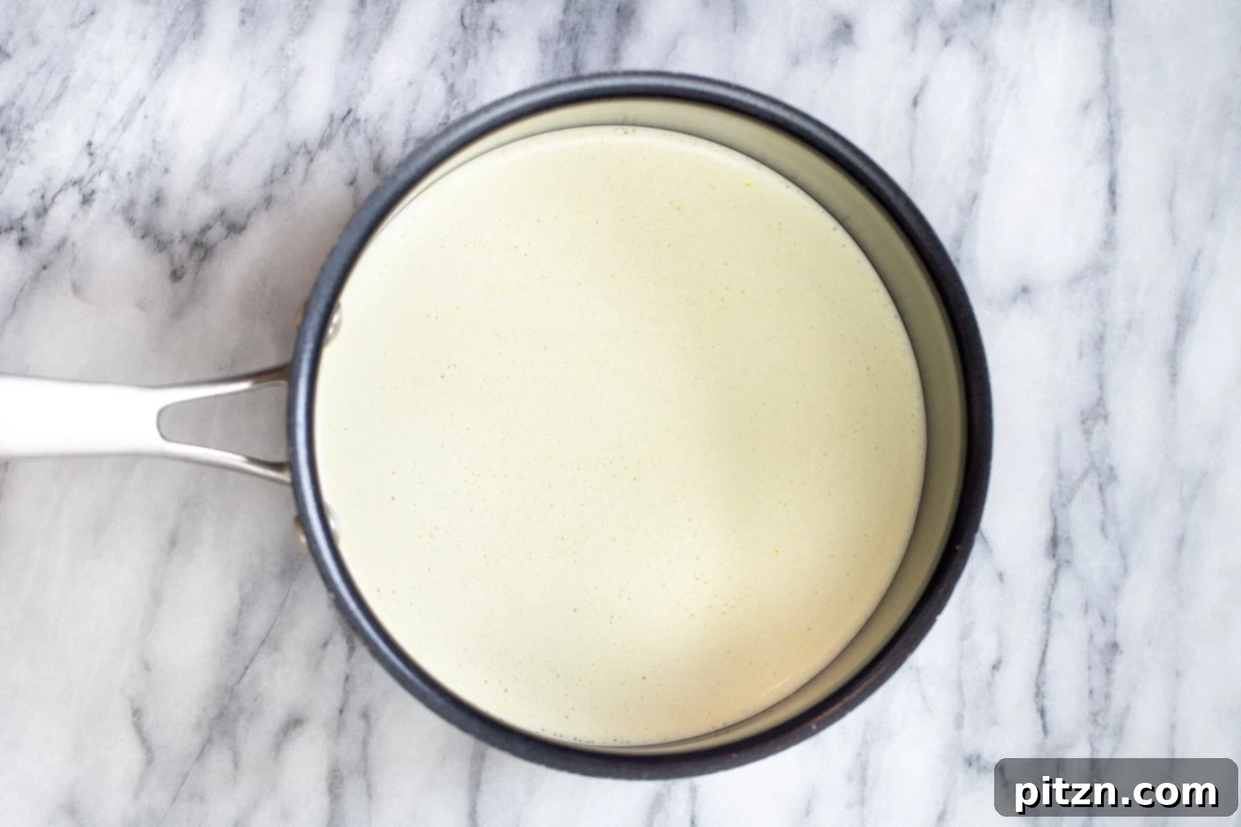 Nut milk in a saucepan
