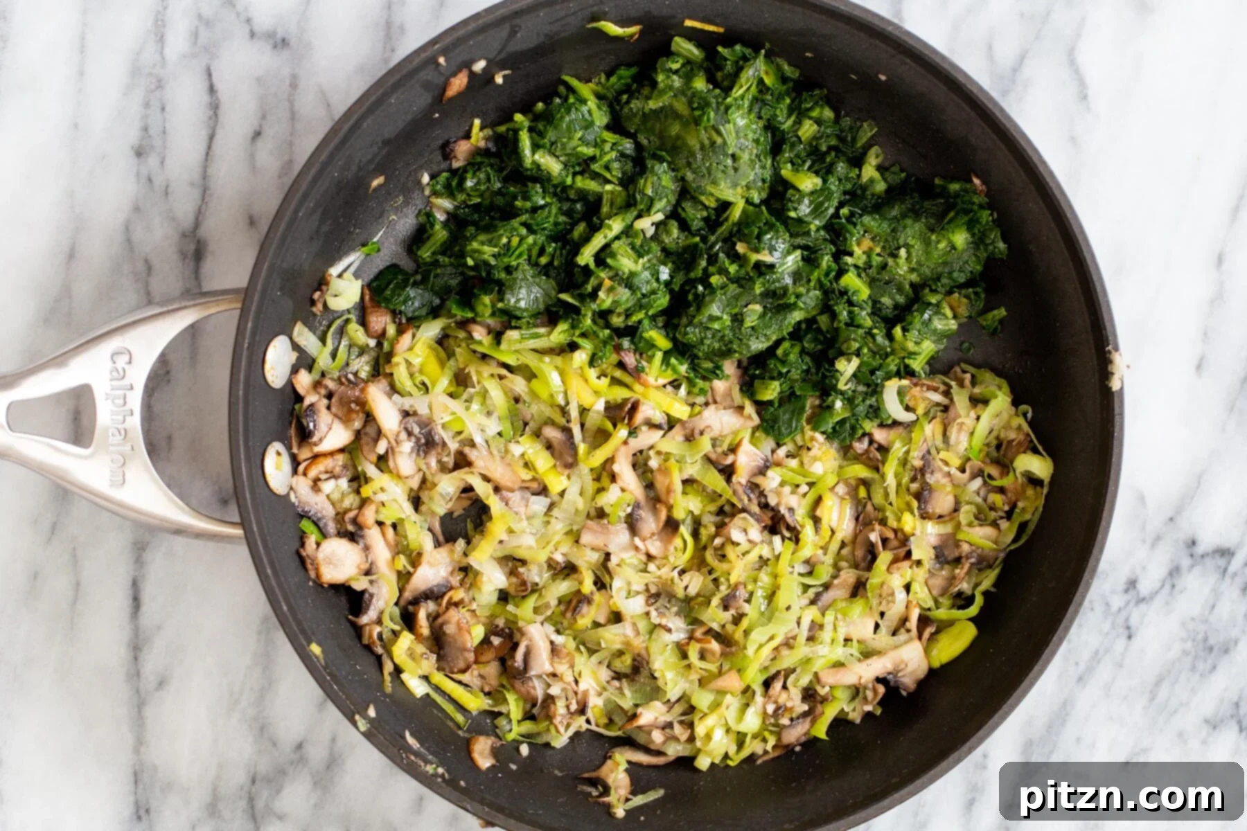Garden Fresh Vegan Quiche with Mushrooms, Spinach and Leeks 7 Sautéed spinach, mushrooms, and leeks simmering in a skillet, their vibrant colors and textures highlighting the rich flavors for the vegan quiche filling.