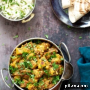 Restaurant Style Aloo Gobi served in a white bowl