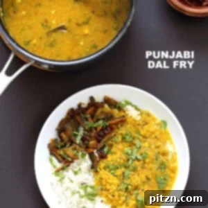 Punjabi Dal Fry in the pan garnished with more cilantro