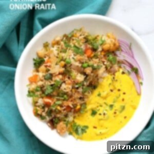 Masala Fried Rice with Turmeric Onion Raita, served in a bowl