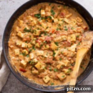overhead shot of a skillet with kali mirch tofu in black pepper sauce