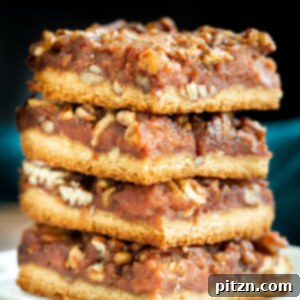 Irresistible Gluten-Free Vegan Pecan Pie Bars 2 Stacked vegan pecan pie bars, ready to be served and enjoyed.