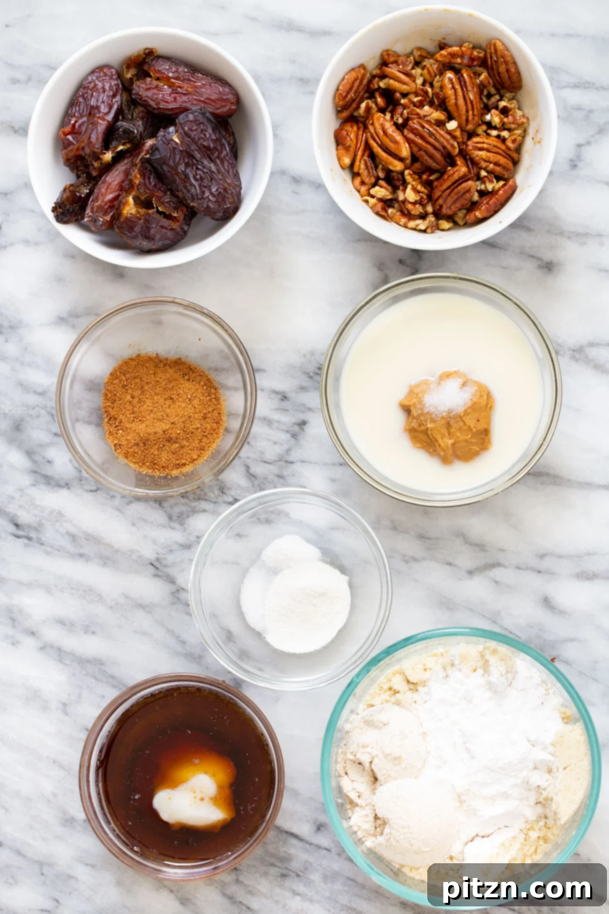 Vegan Pecan Pie Bars Ingredients All the fresh and wholesome ingredients laid out on a marble counter, ready for making vegan pecan pie bars.