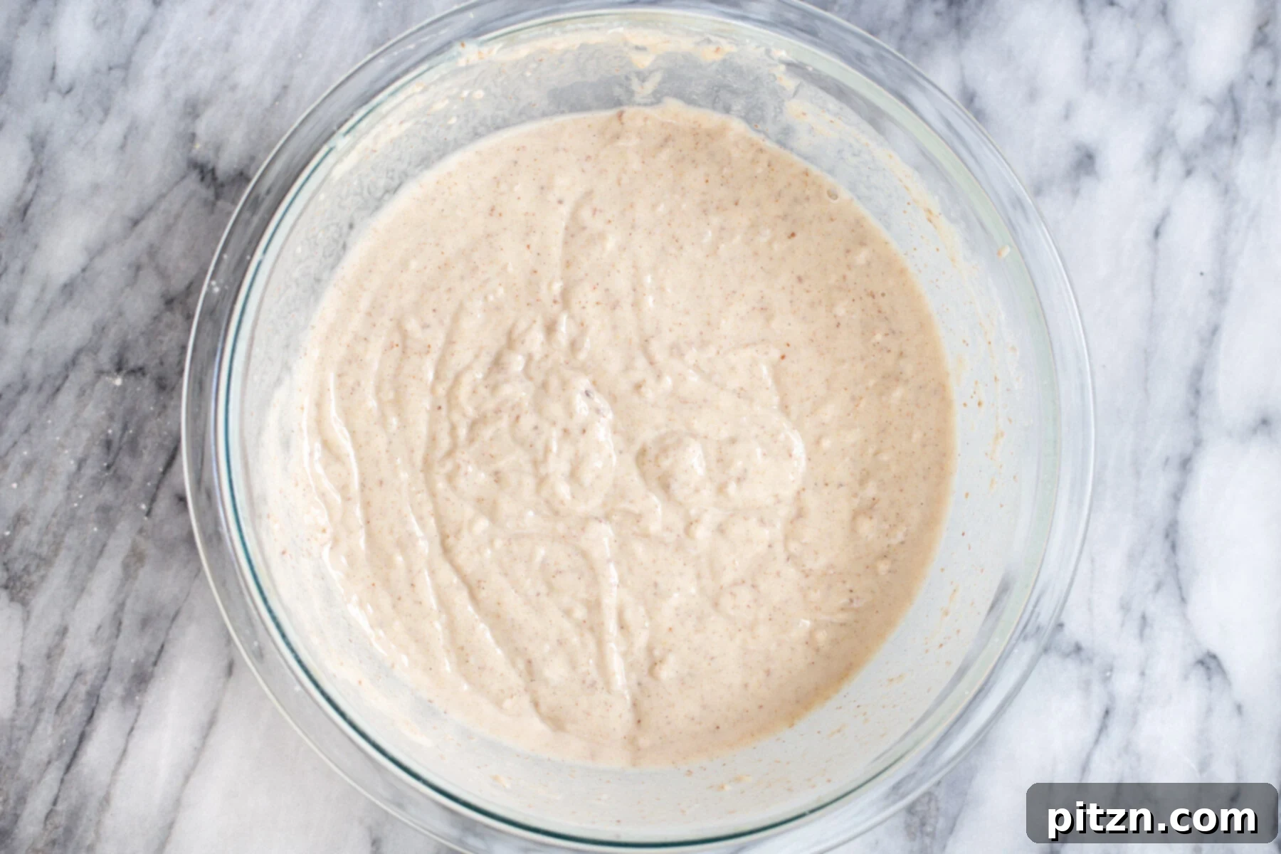 Easy Vegan Sheet Pan Pancakes 4 vegan sheet pancakes batter in a glass bowl